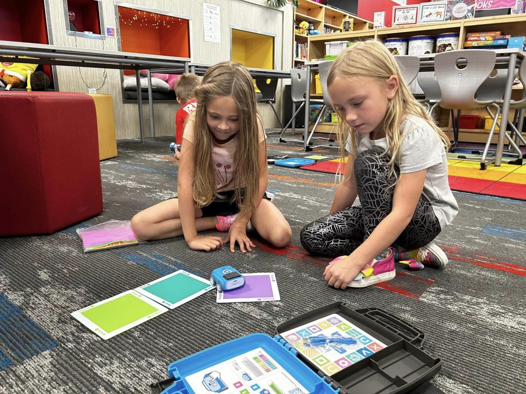 students in classroom making an activity 