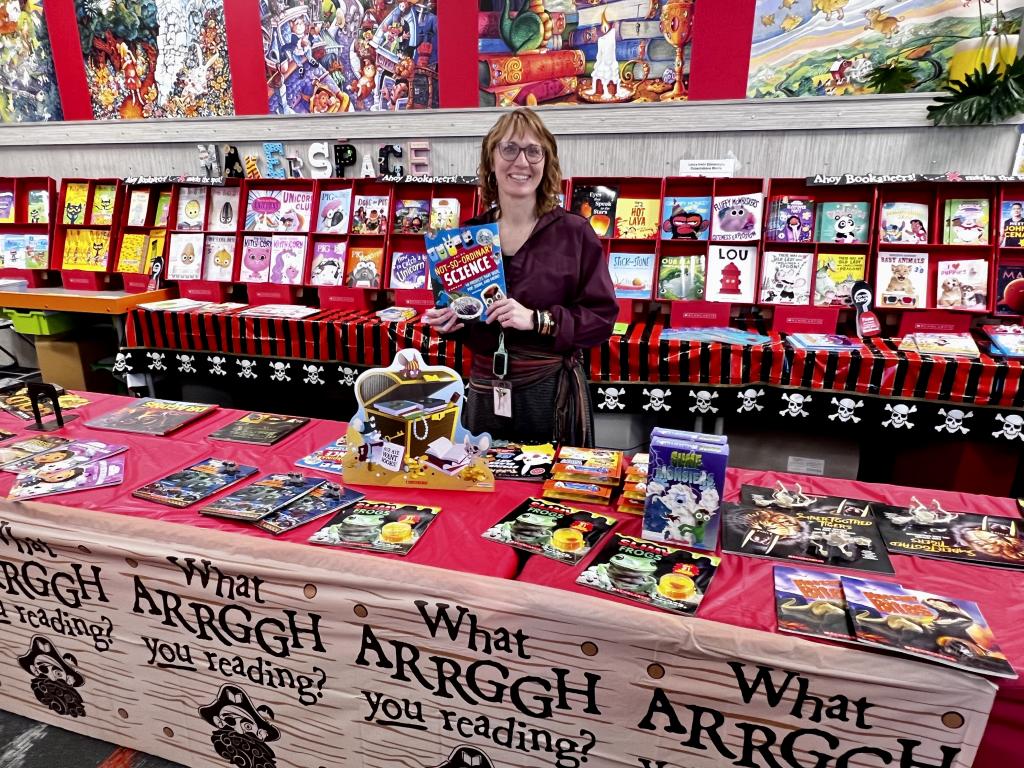 Personal at a library stand 