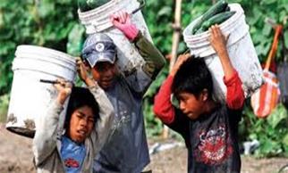 3 migrants carrying buckets