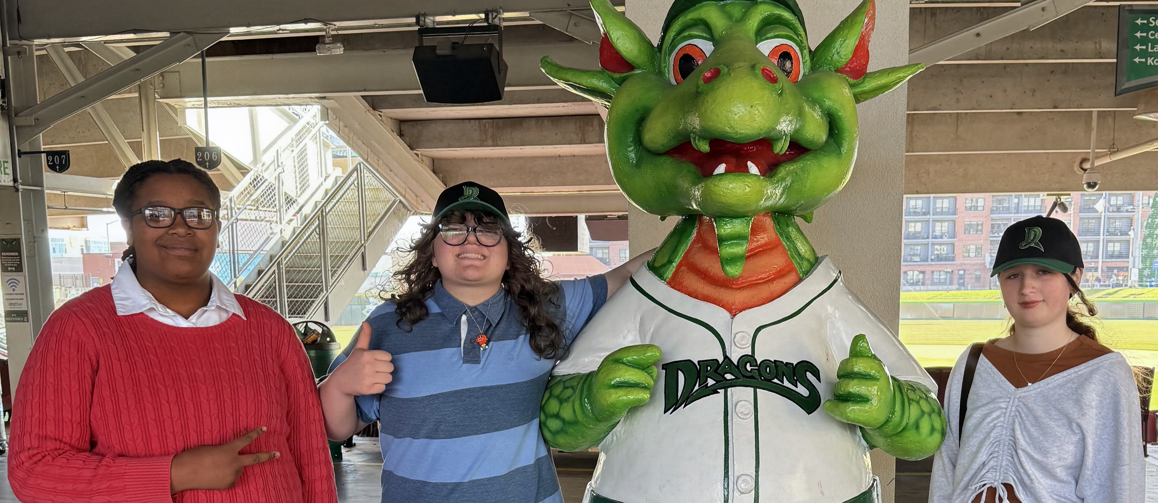 3 students with Heater, the Dayton Dragons mascot