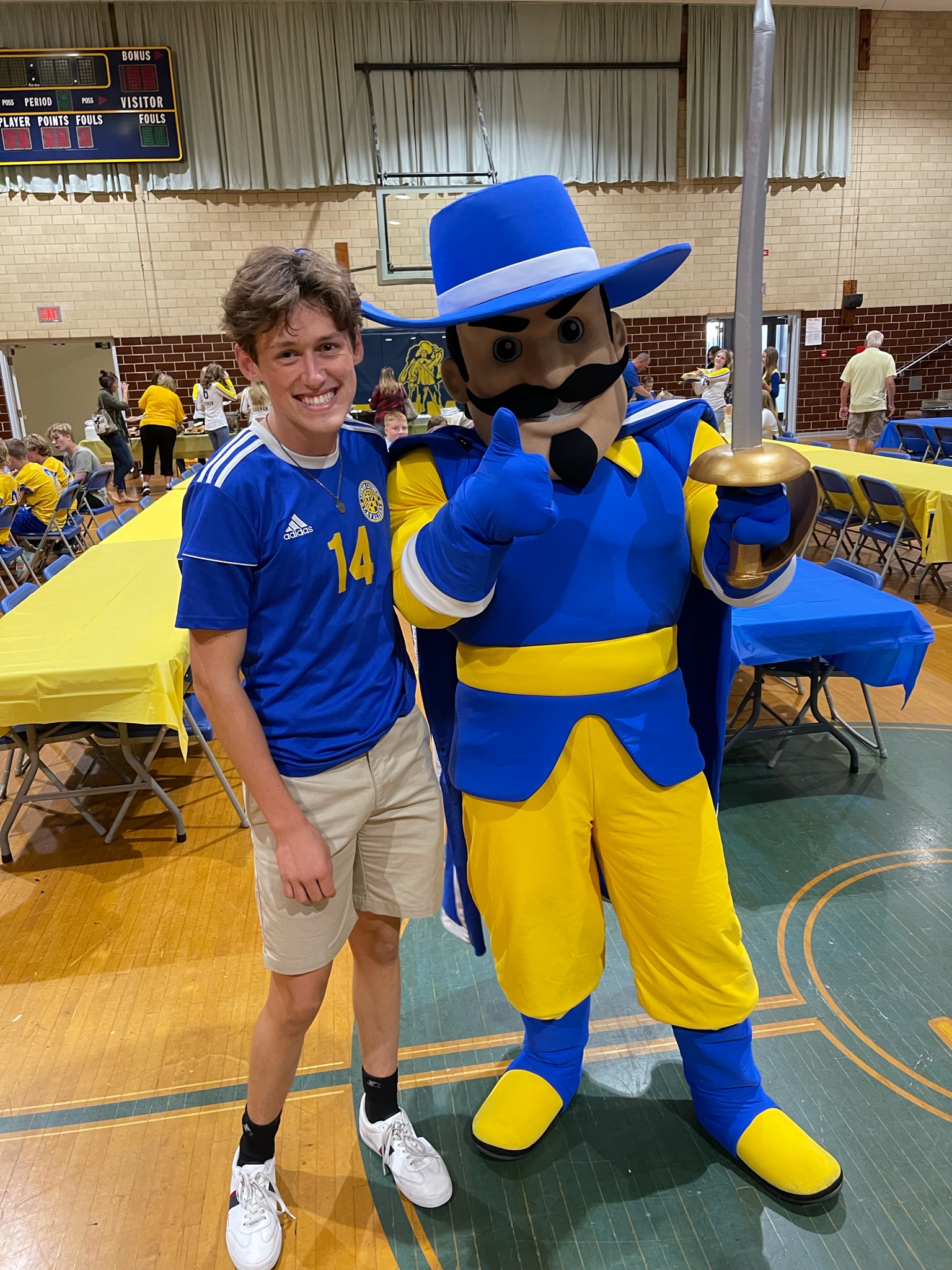 Mascot with student