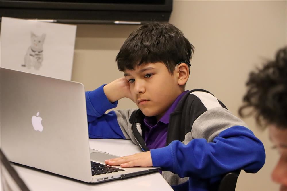 boy using a laptop