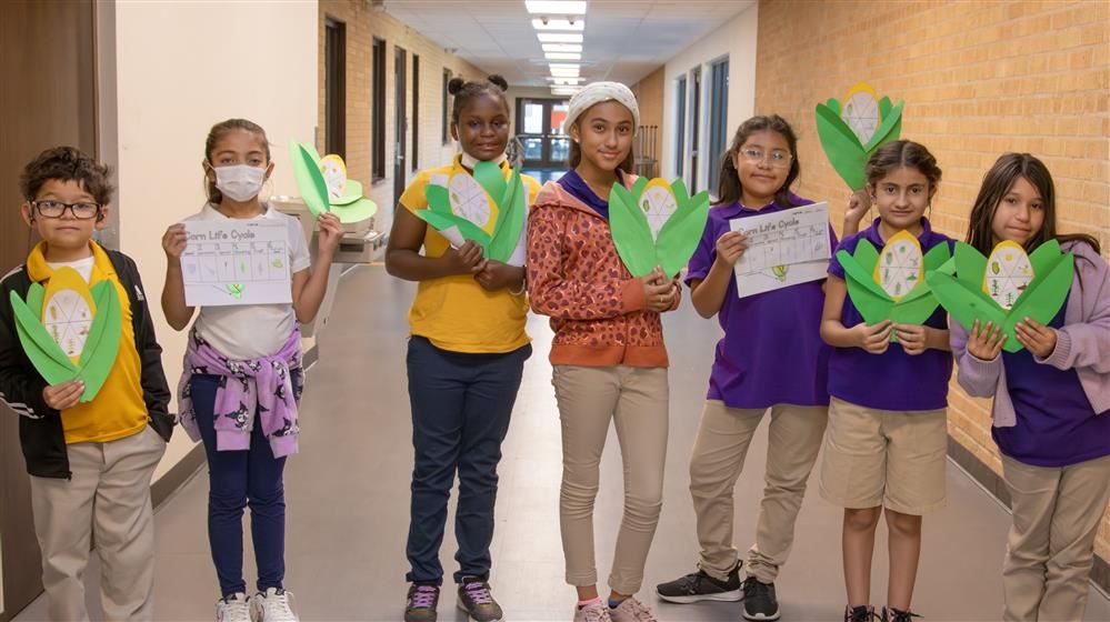 students holding a project