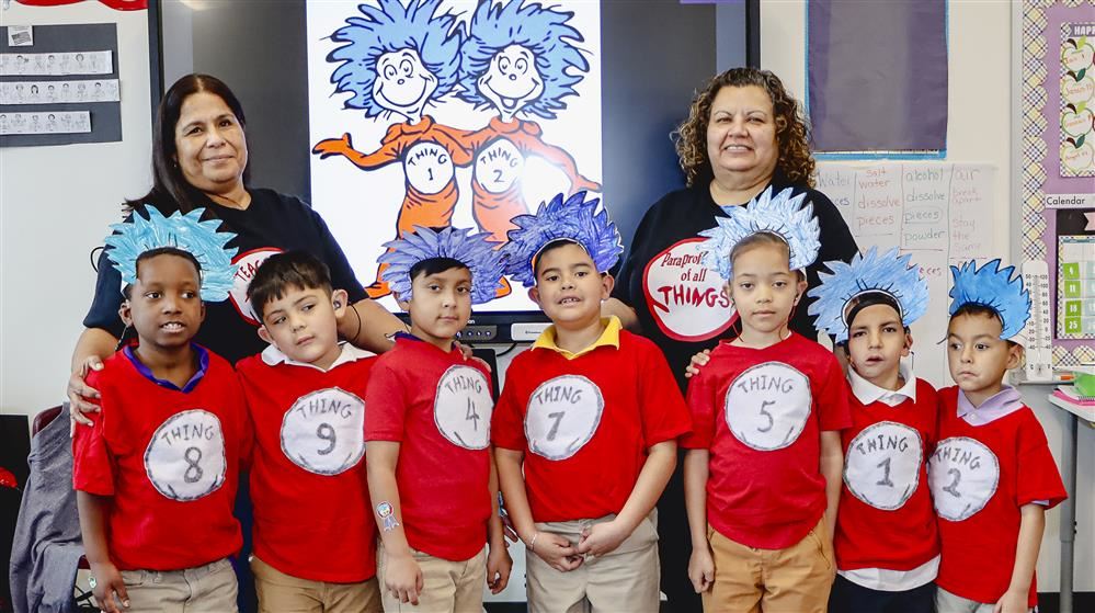 students and school staff dressed with costumes
