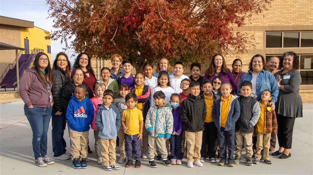 students and school smiling