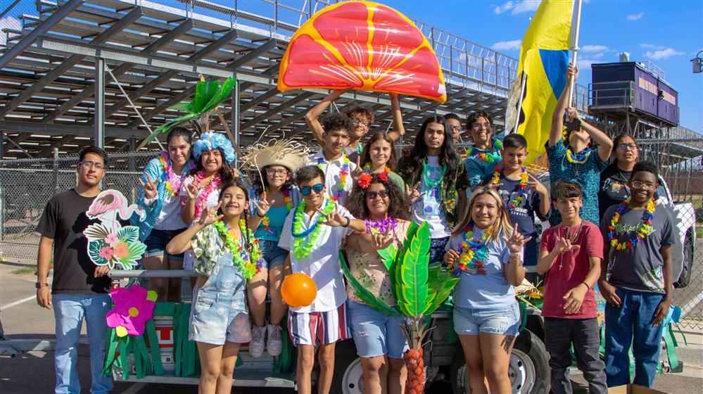 students smiling at the homecoming
