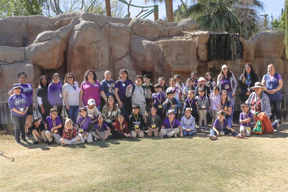 students at the zoo smiling