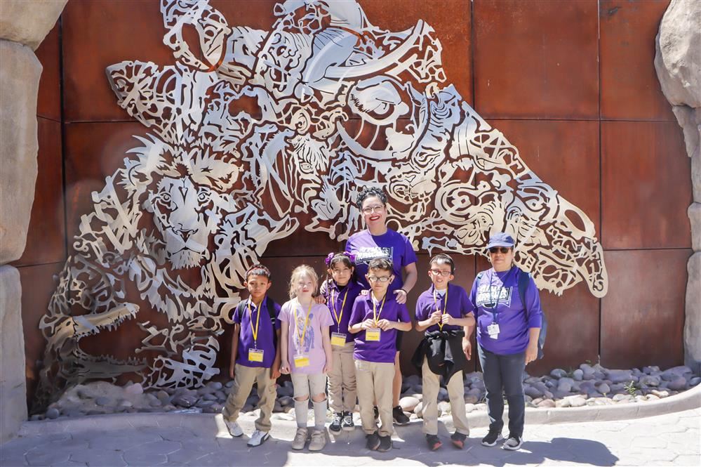 students at the zoo smiling