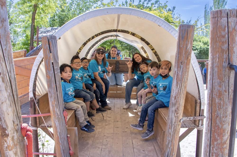 students sitting inside a carrousel