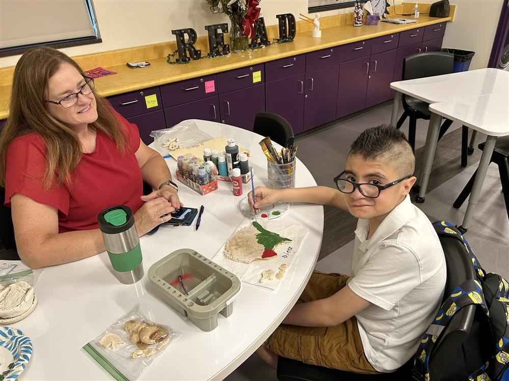 teacher and student working together