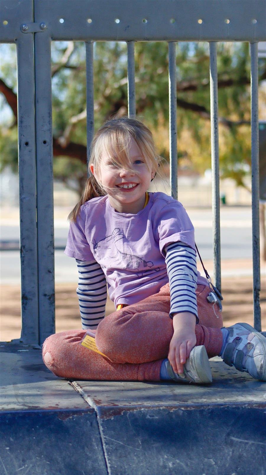kid playing on the play ground