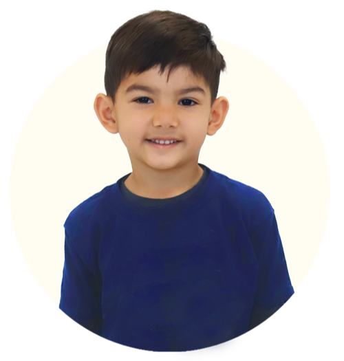 Smiling child wearing a blue shirt