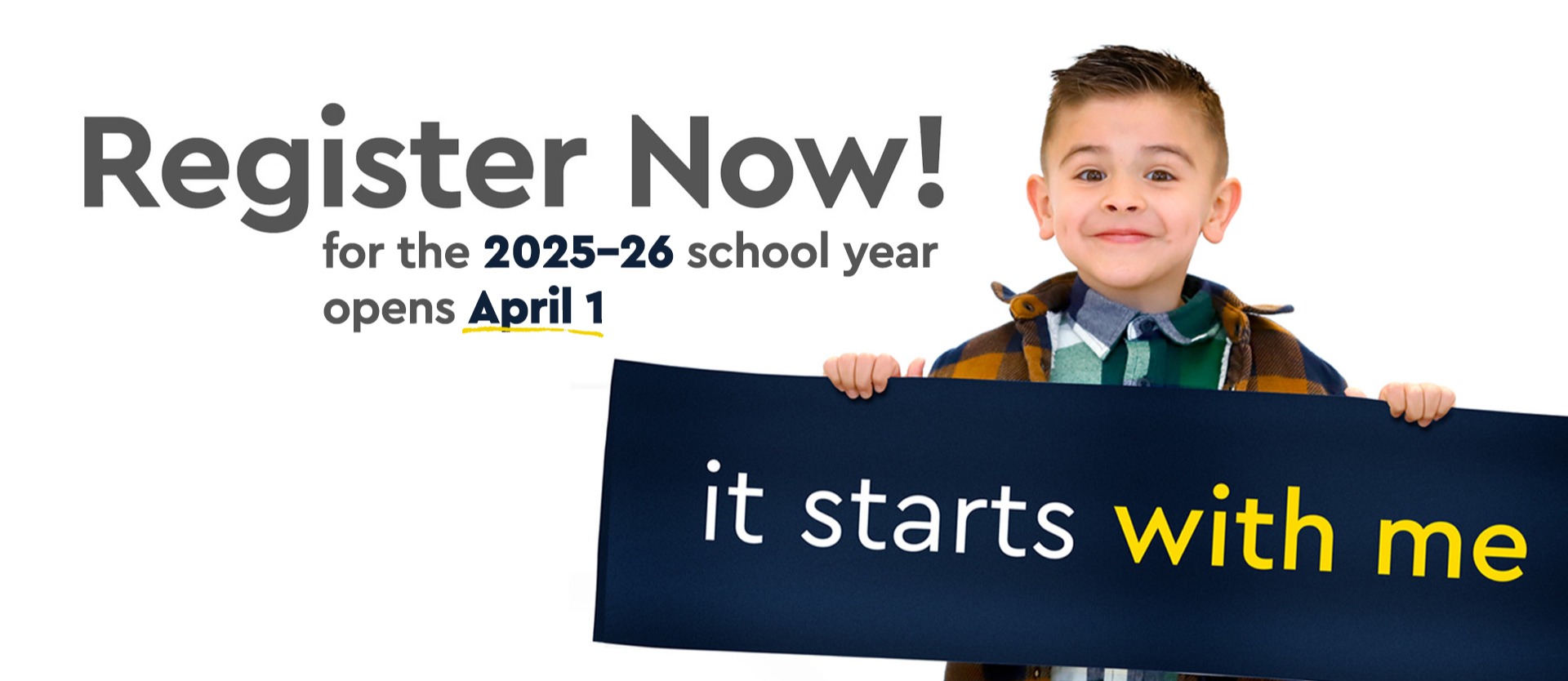 small child holding it starts now sign in front of a wall reading register now