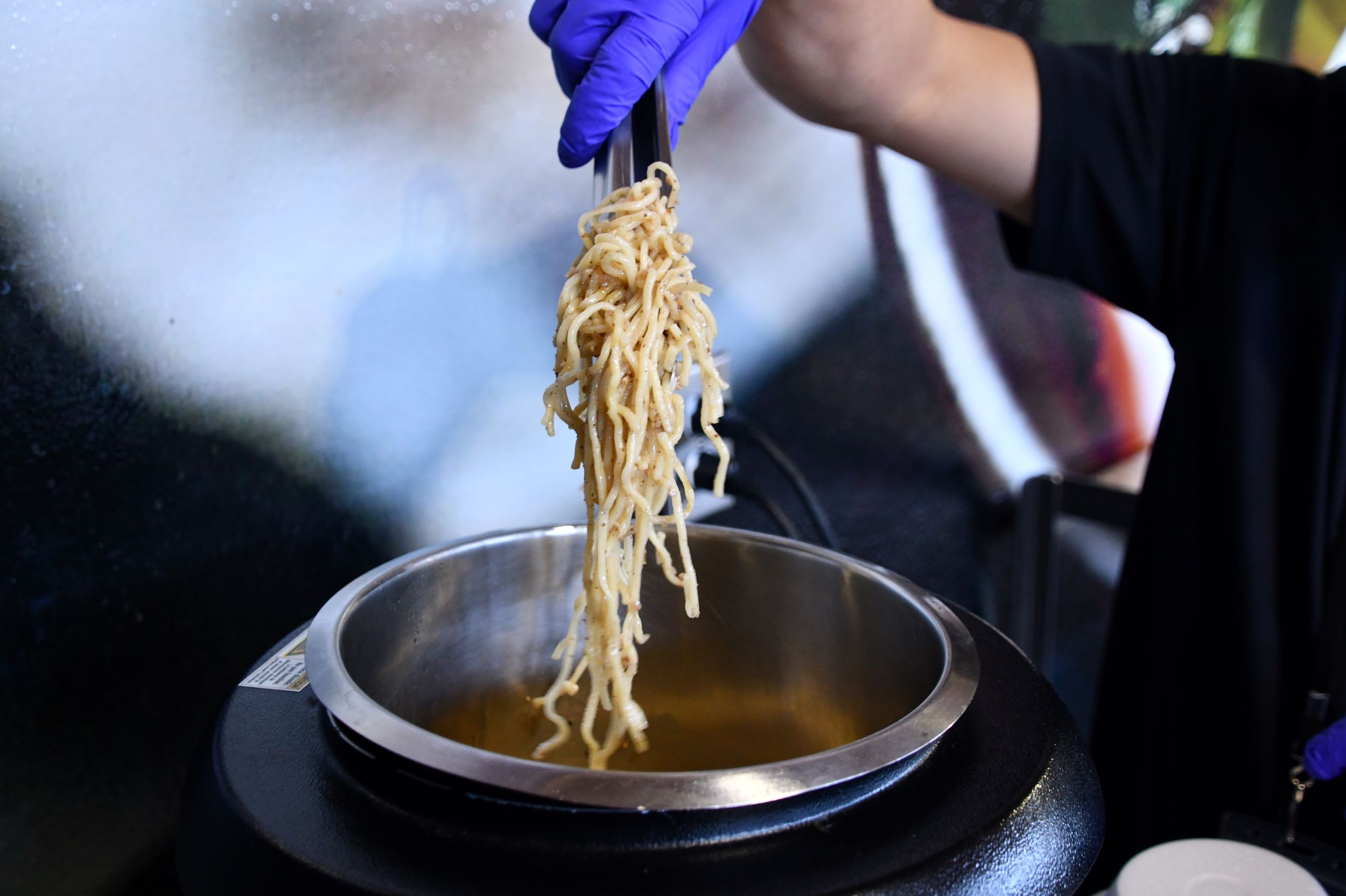 Noodles coming out of a hot pot