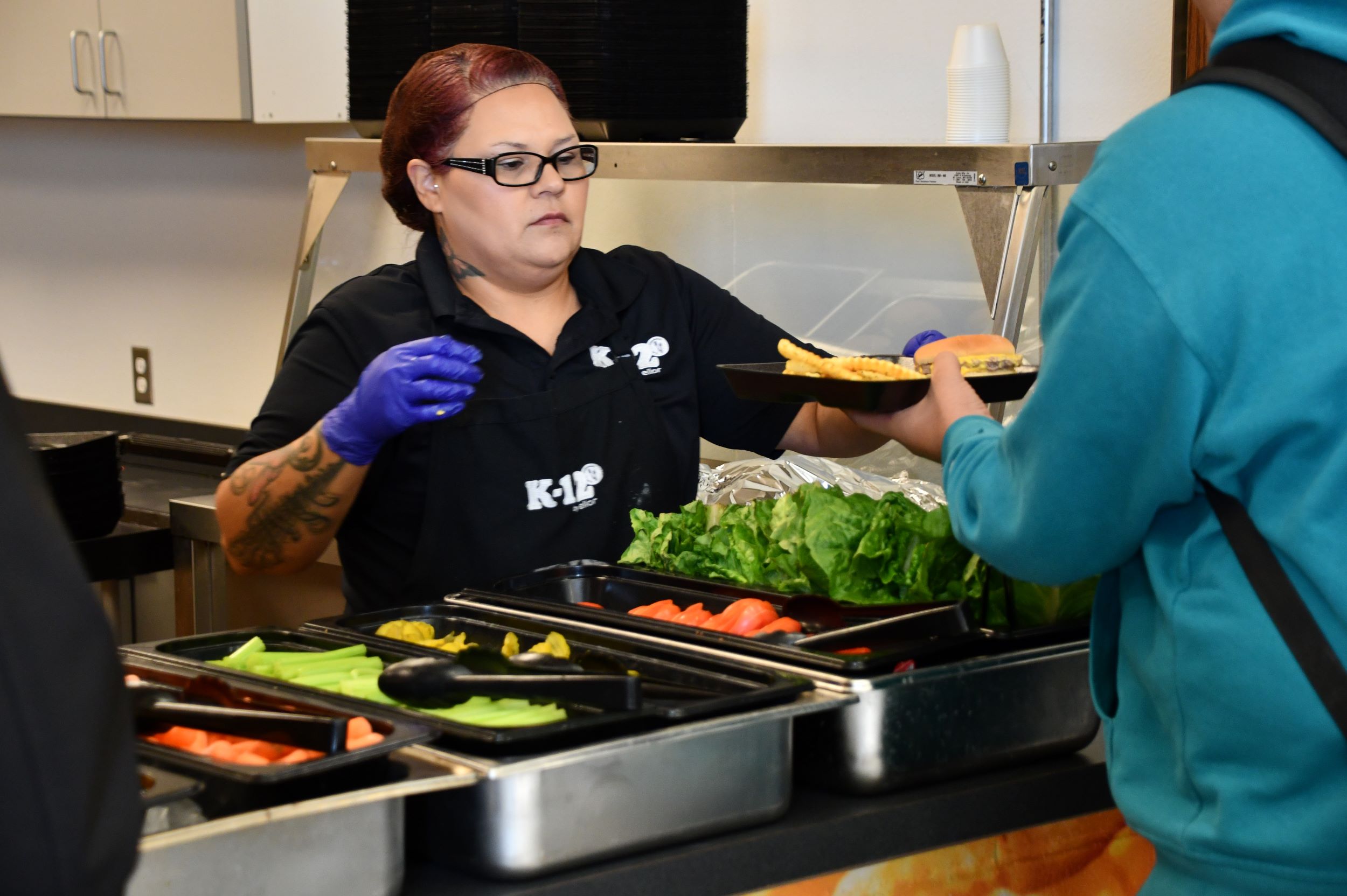 kitchen staff serving food