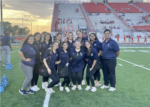 athletic trainers together at the campus