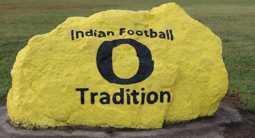 Indian Football Tradition painted on a yellow rock