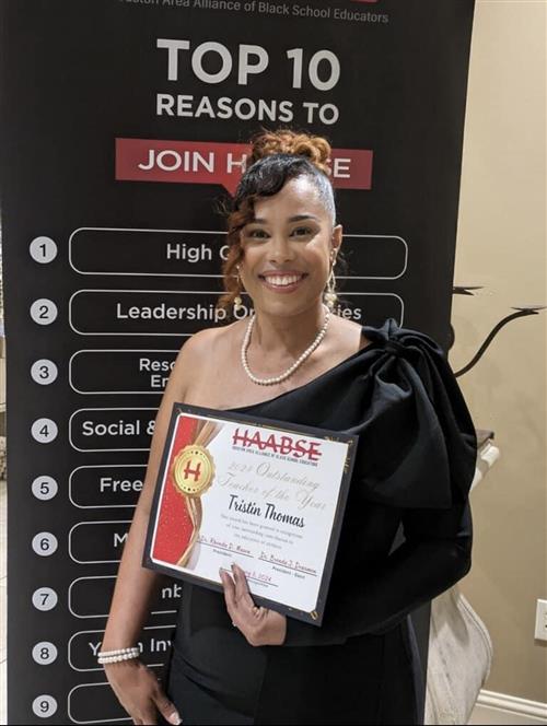 Mrs. Thomas with her diploma