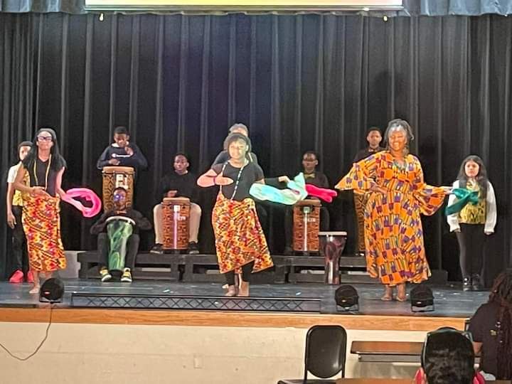 three women in a presentation dancing