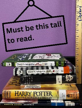 books being measure against a yardstick