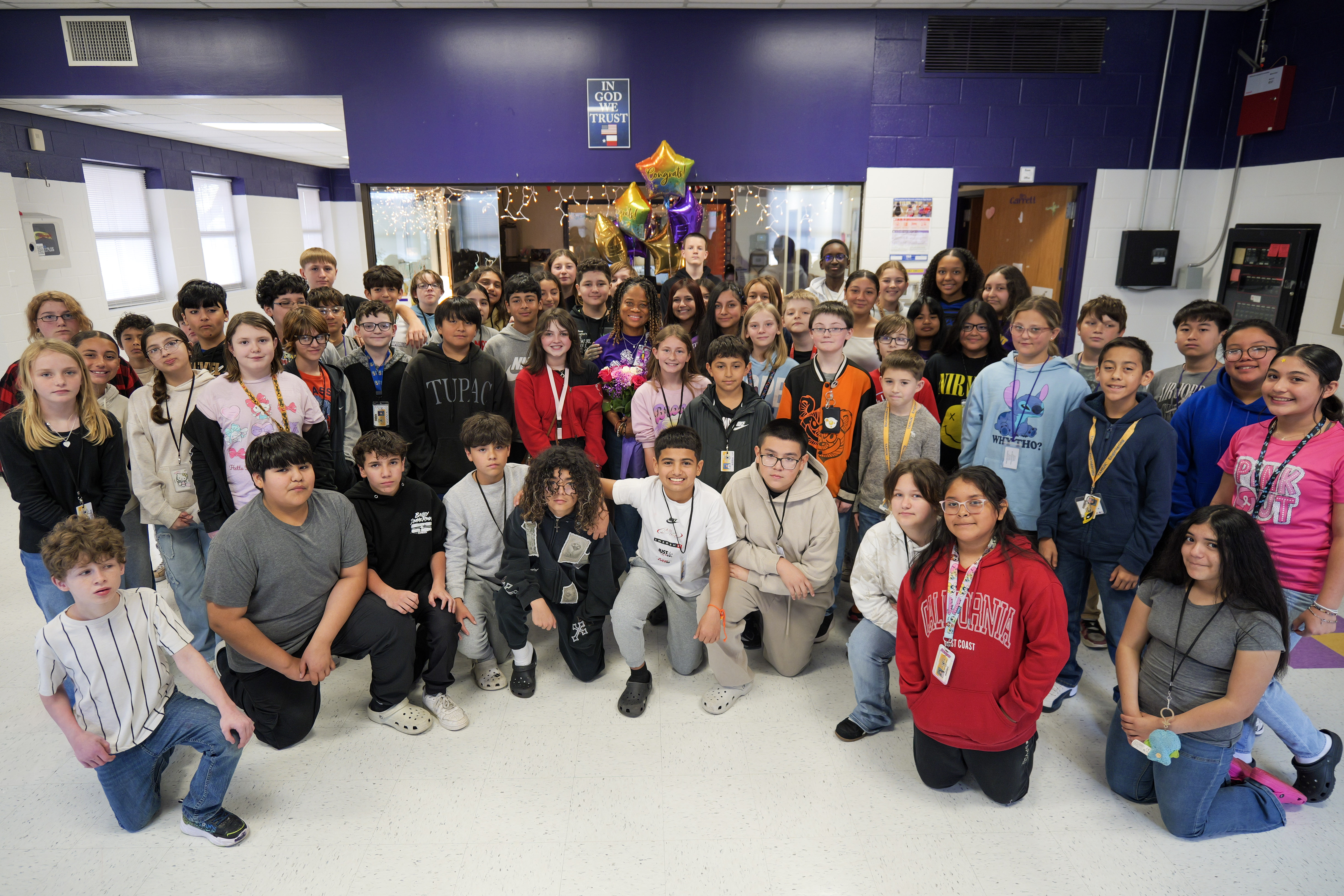 large group of students around a teacher