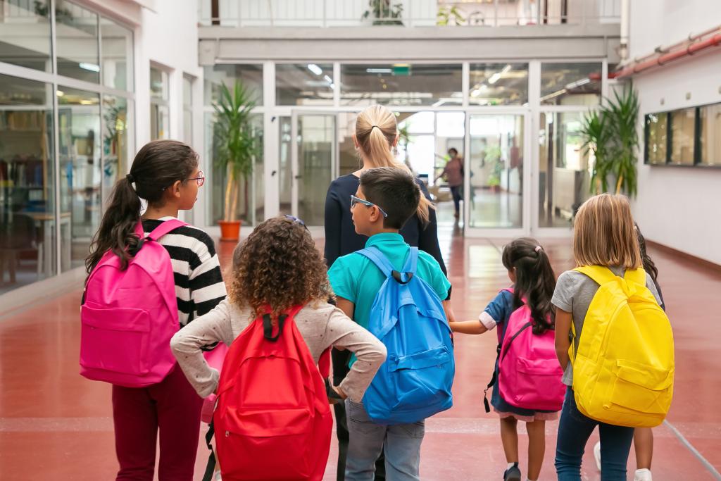 kids walking out of a building 