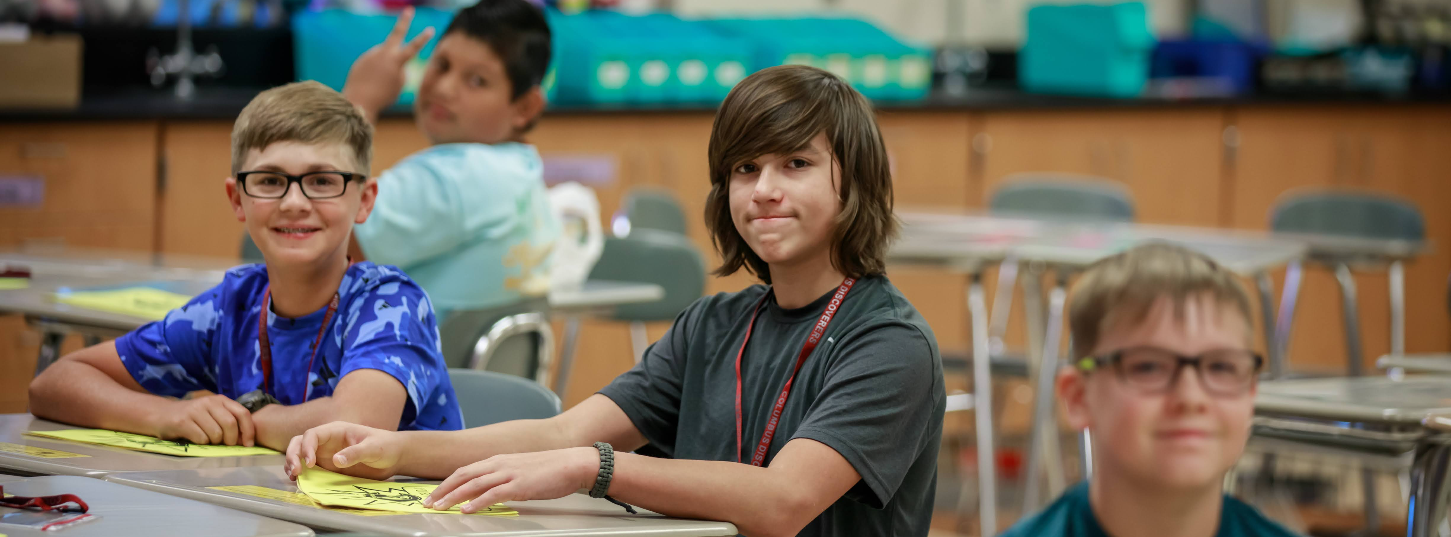 A group of CMS students smile at the camera during their first day of school in August of 2023.