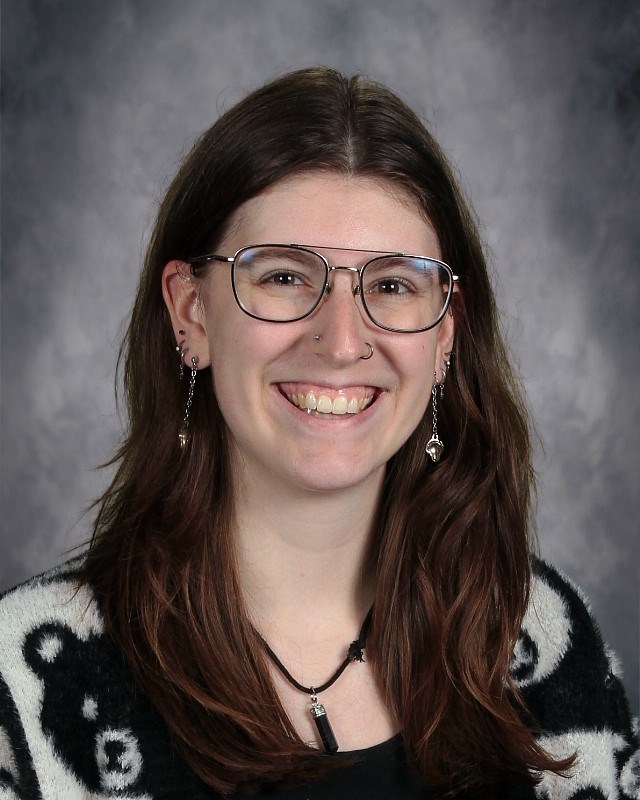 Jillian McCarter, Centennial Elementary media specialists, is smiling in front of a gray background in this mugshot.