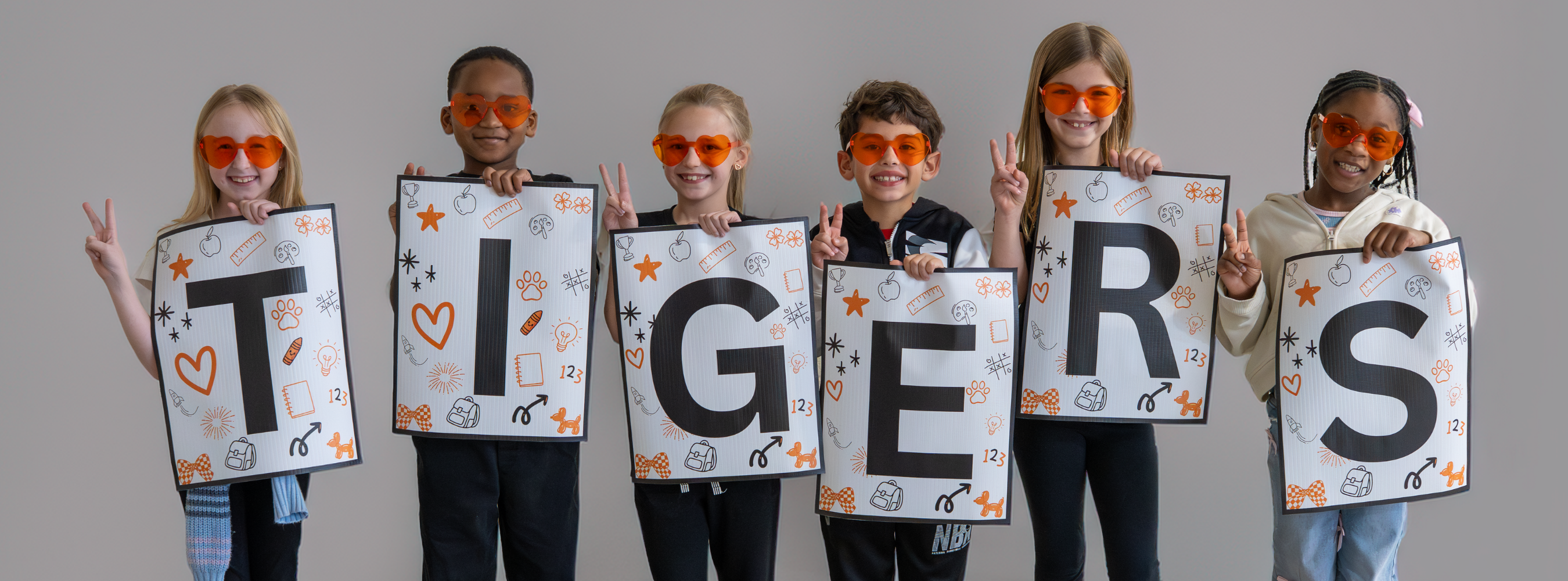 Freedom students spelling out the word Tigers 