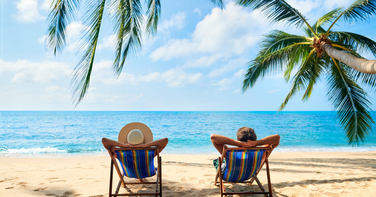image of two people lounging on a beach
