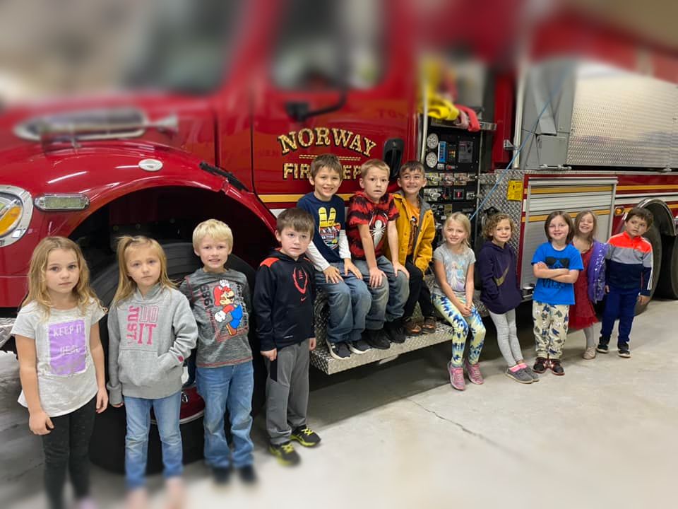 image of kids in front of Firetruck