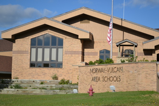 image of brown building which is the outside of Norway Vulcan schools