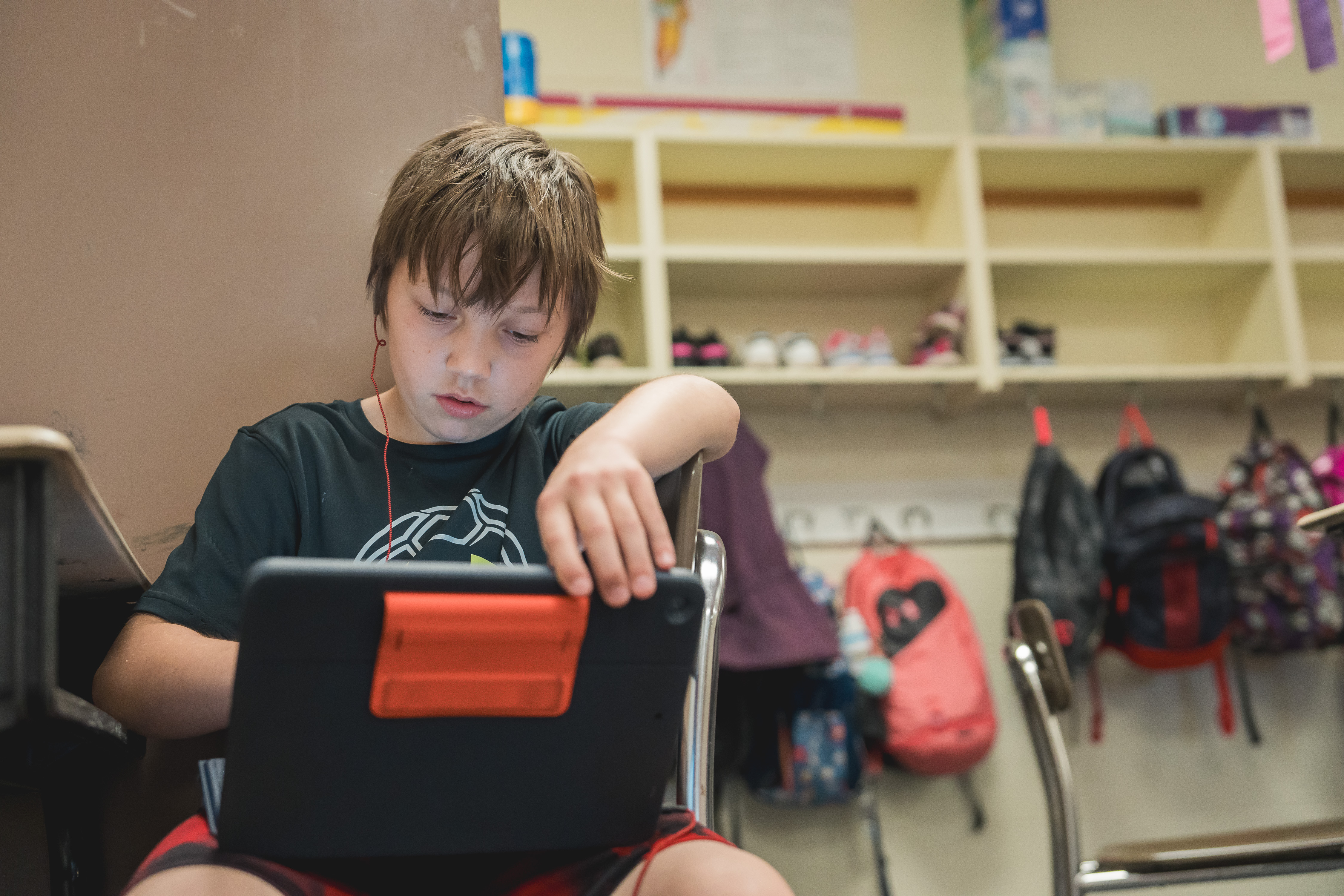 NV Student interacting with iPad