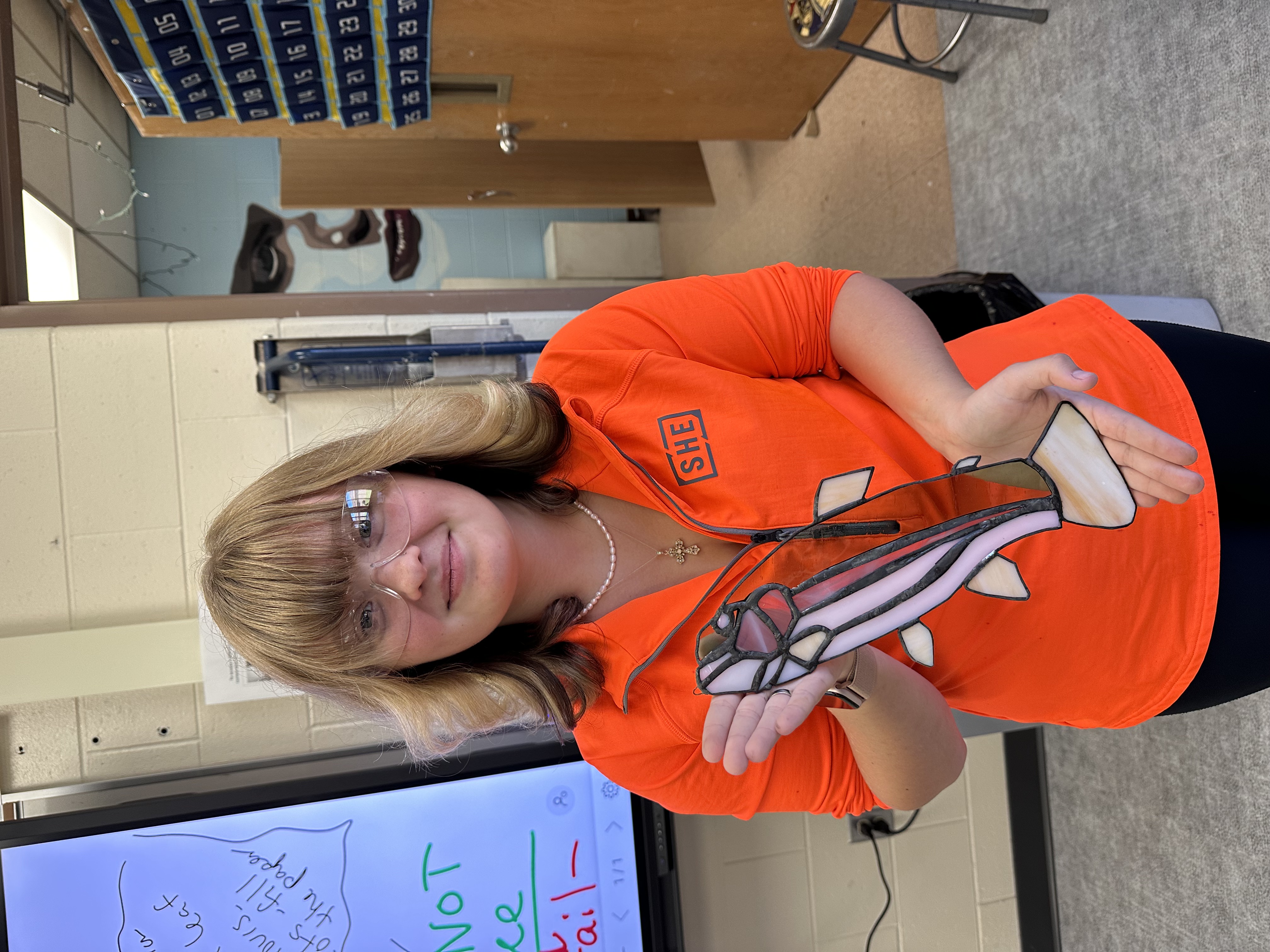 Female art student with a stained glass fish