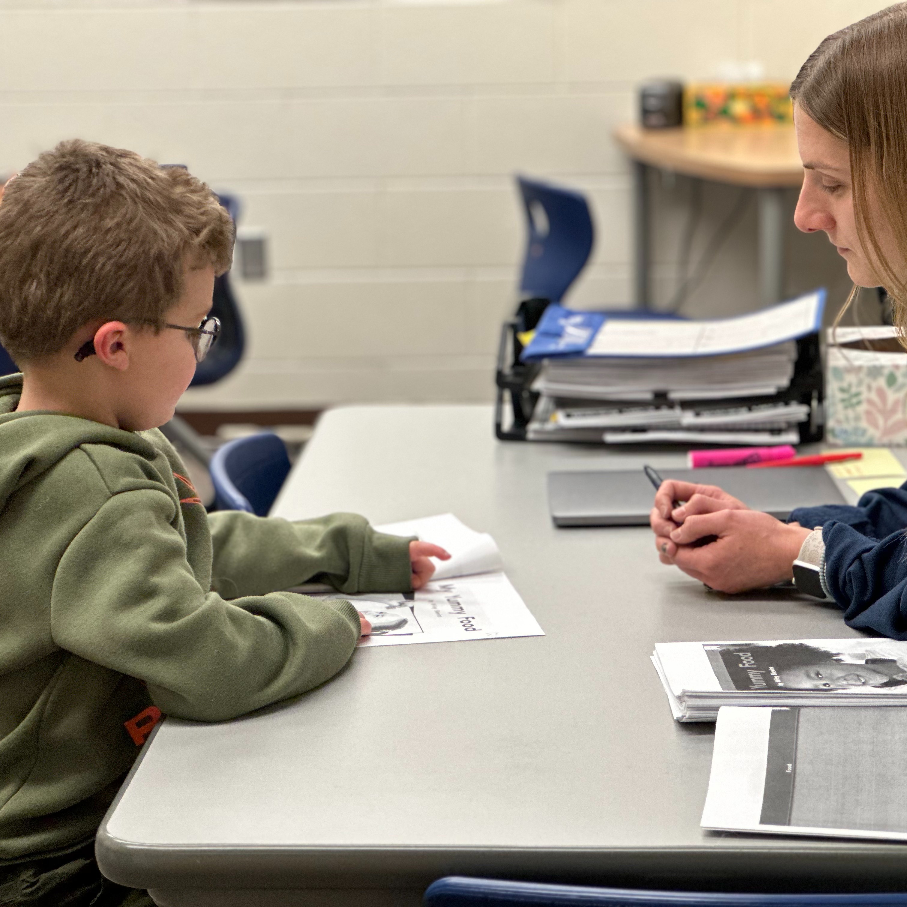 students working with staff