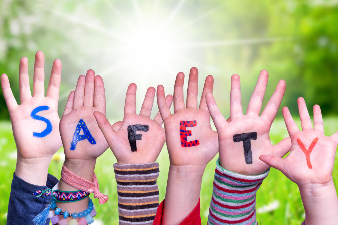 Image of children hands, each with a letter on them spelling out SAFETY