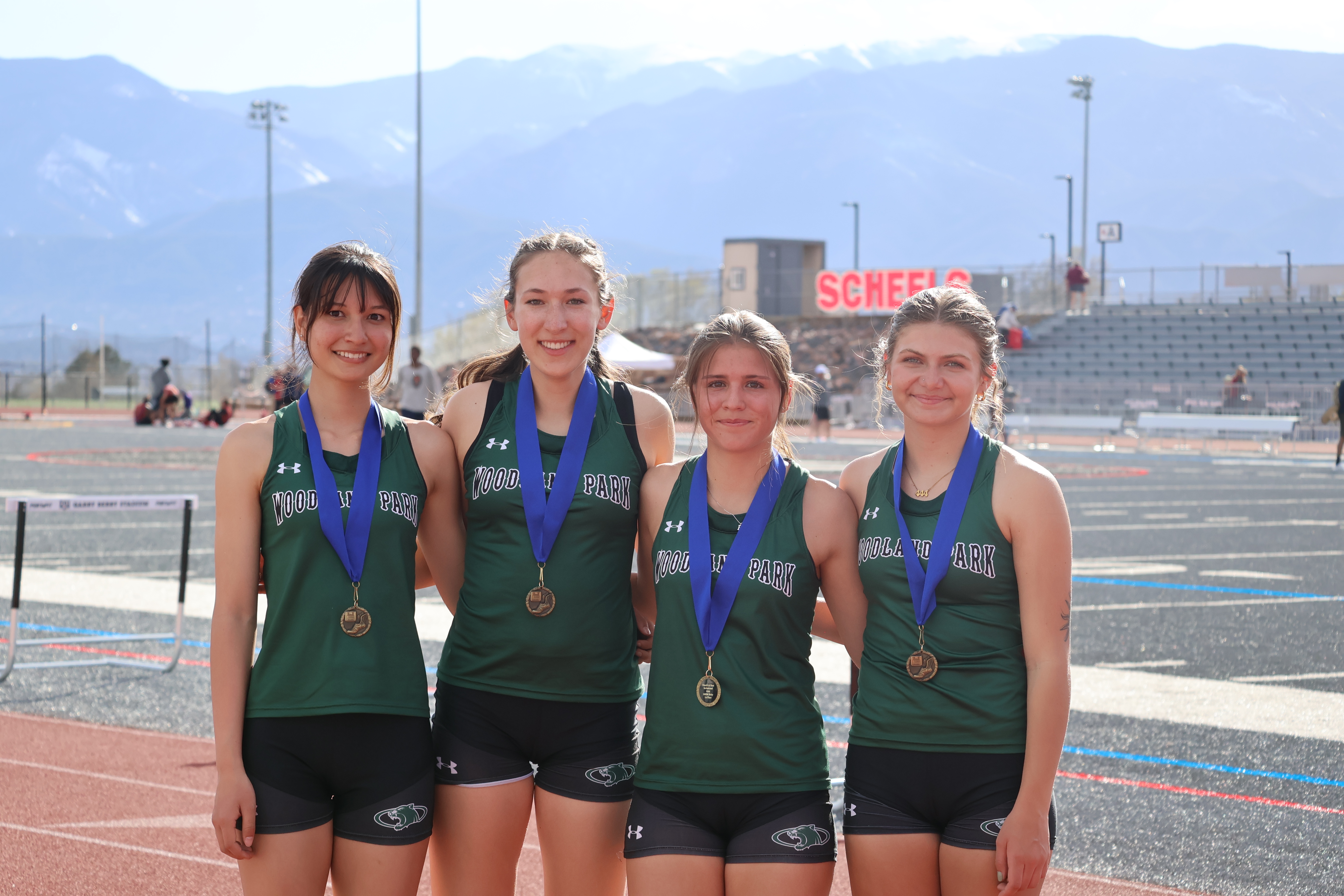 Student Track and Field Athletes with Medals 