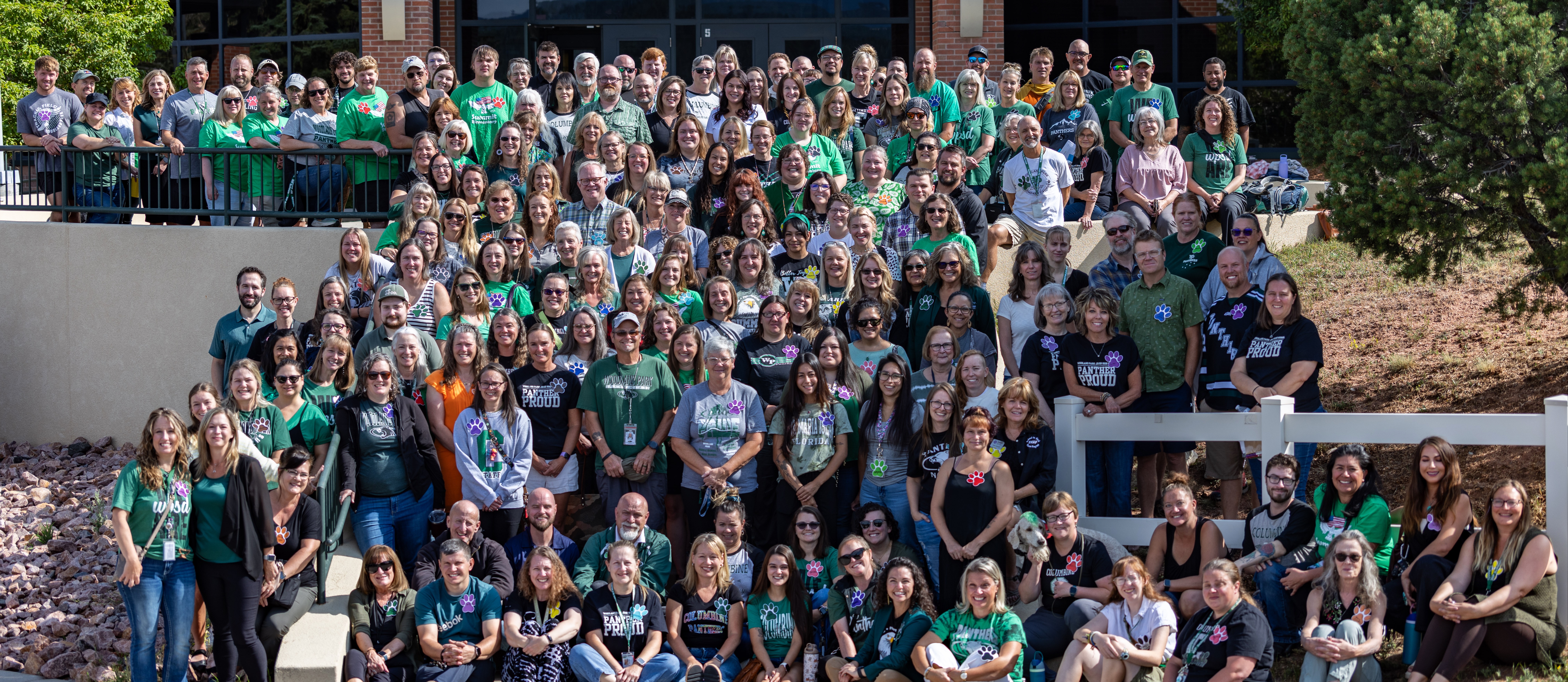 All staff posing on the steps of the Jr./Sr. High School
