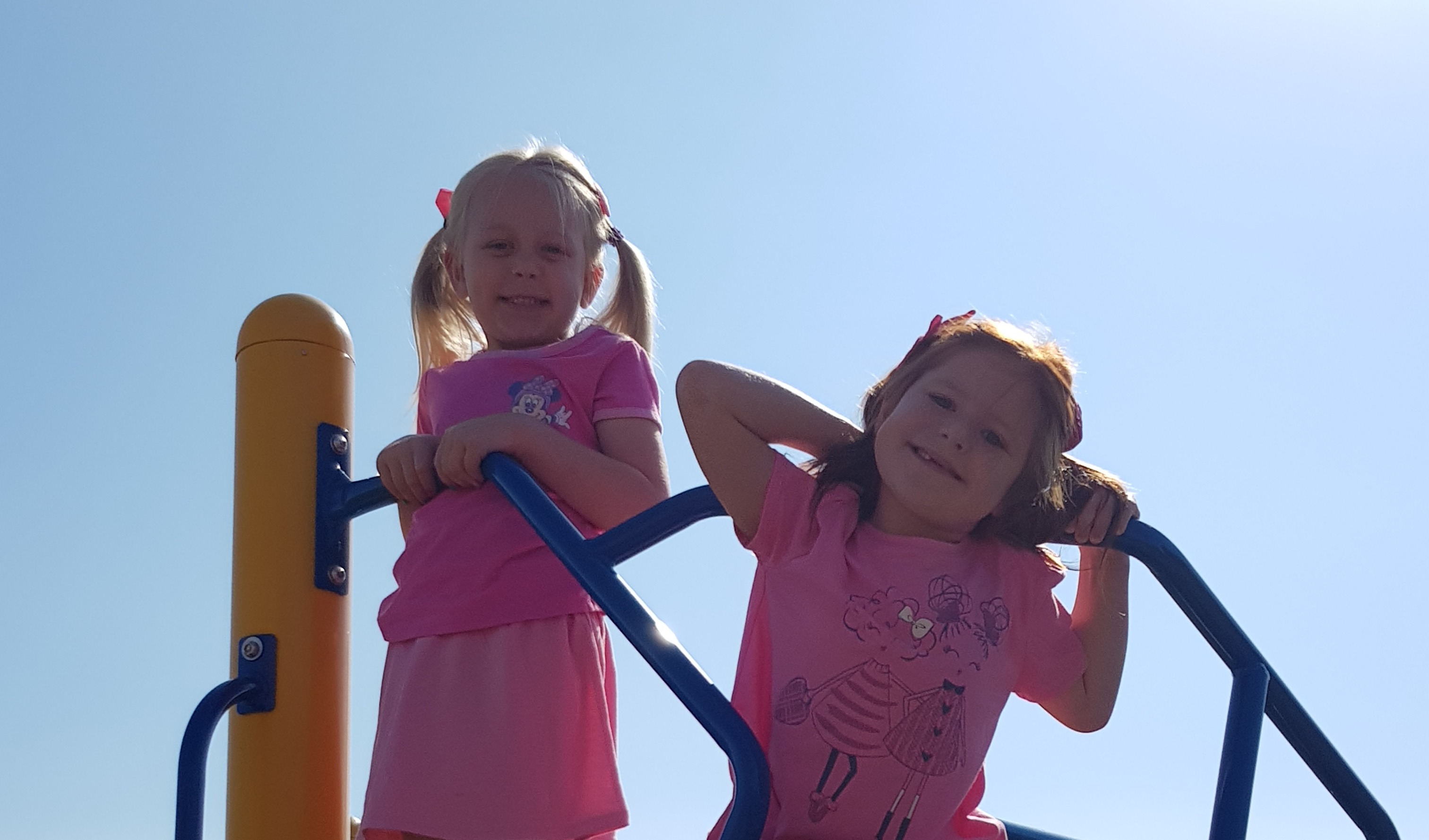 Two girls playing in the playgroud