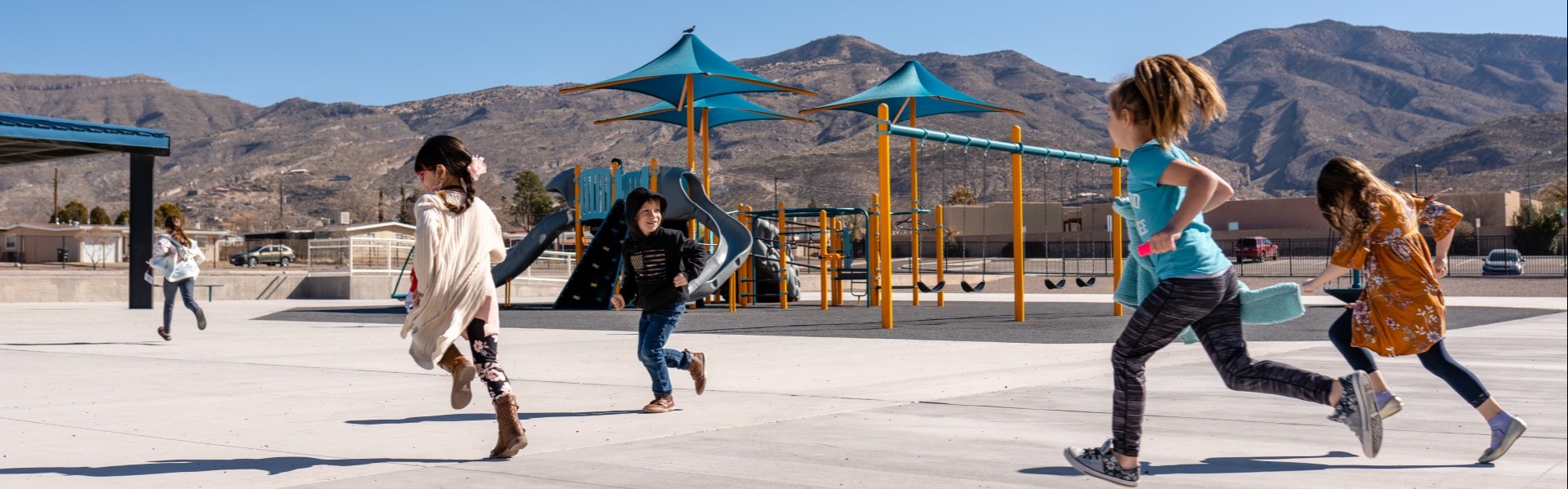 Kids running onto a playground