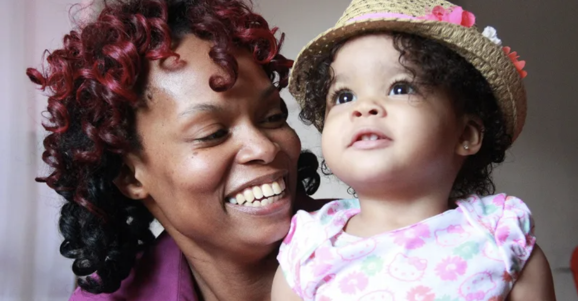 mother and daughter smiling