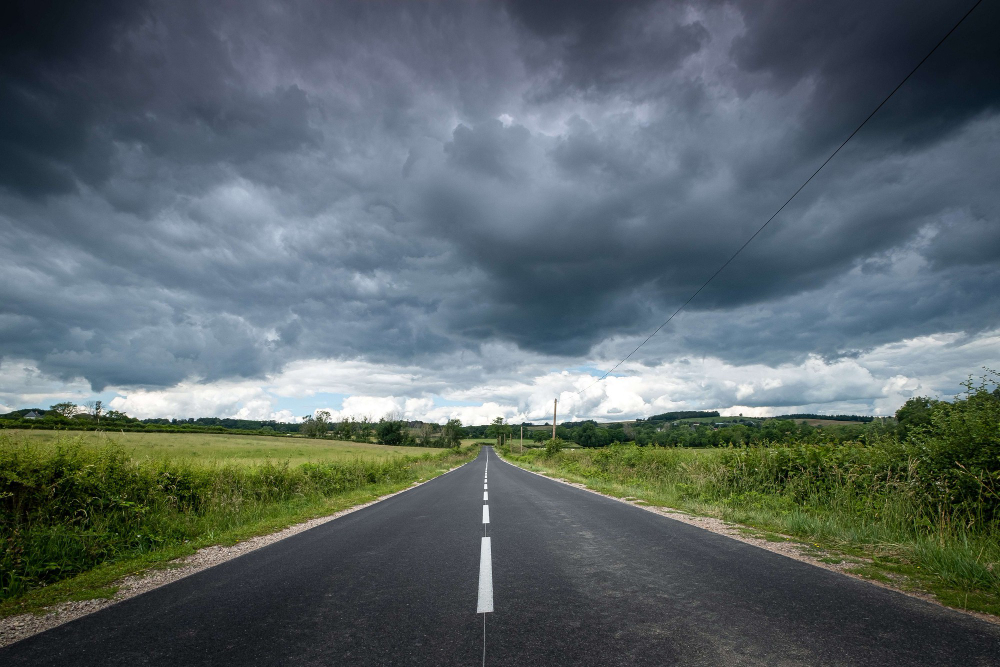 road with imposing storm clouds