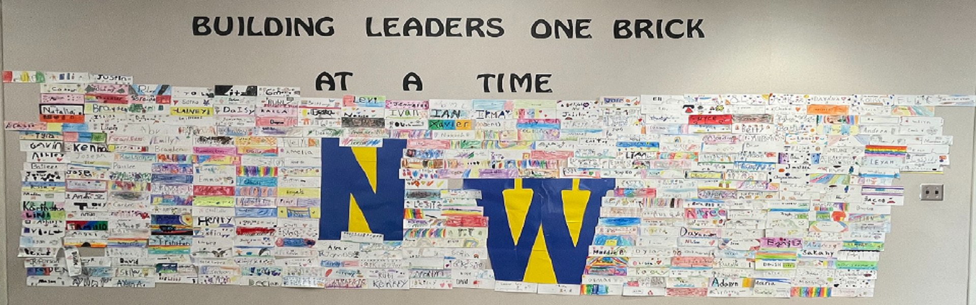 a wall with letters talking about leaders