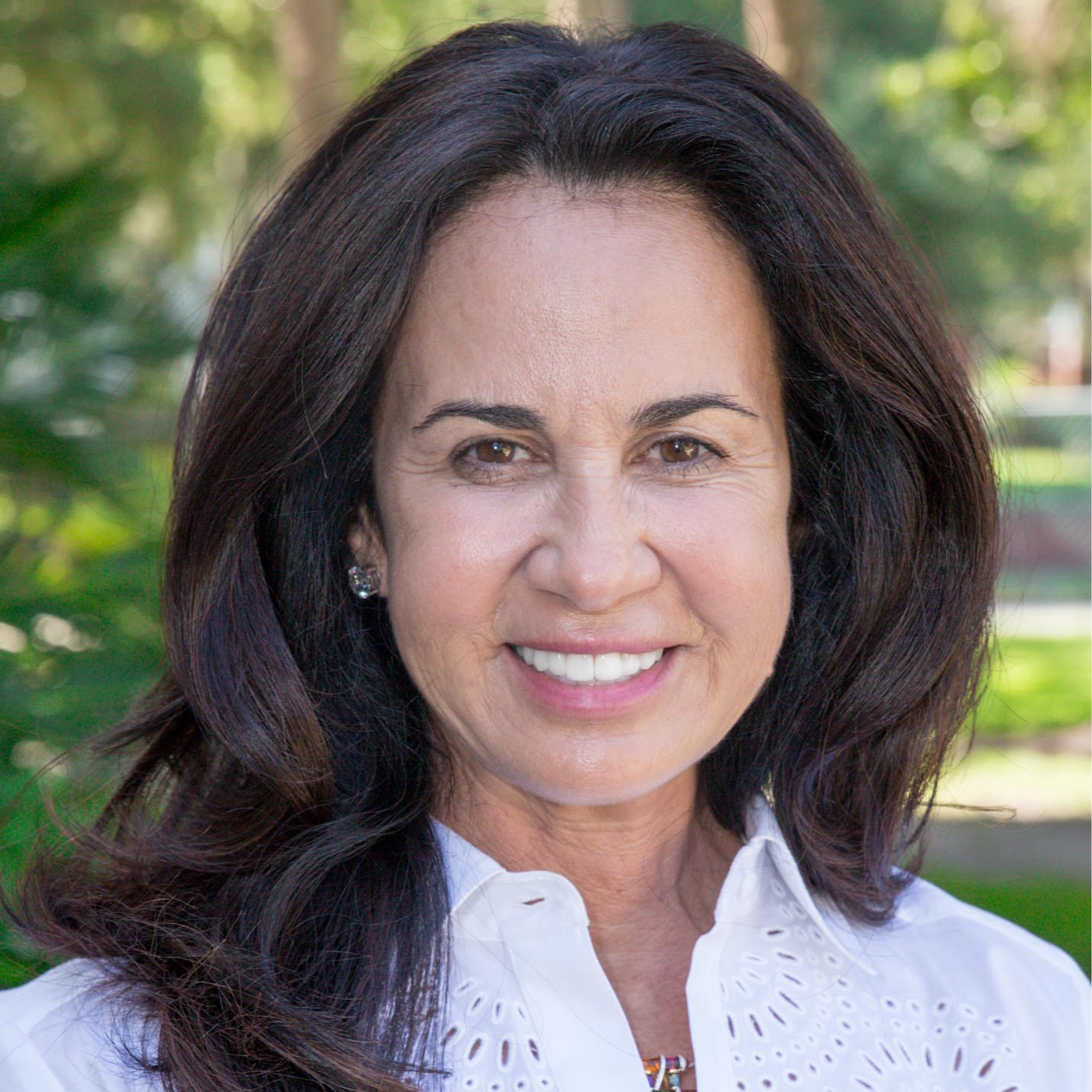 Christine Chapman wearing a  white blouse.