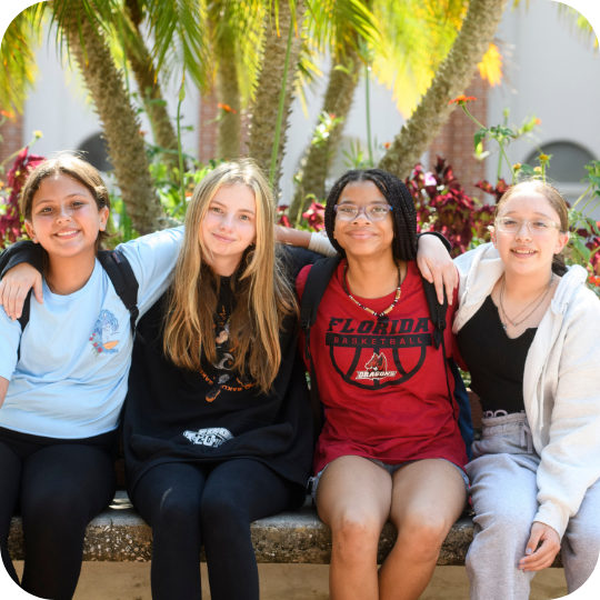 Four Deaf Middle School girls posing for group picture