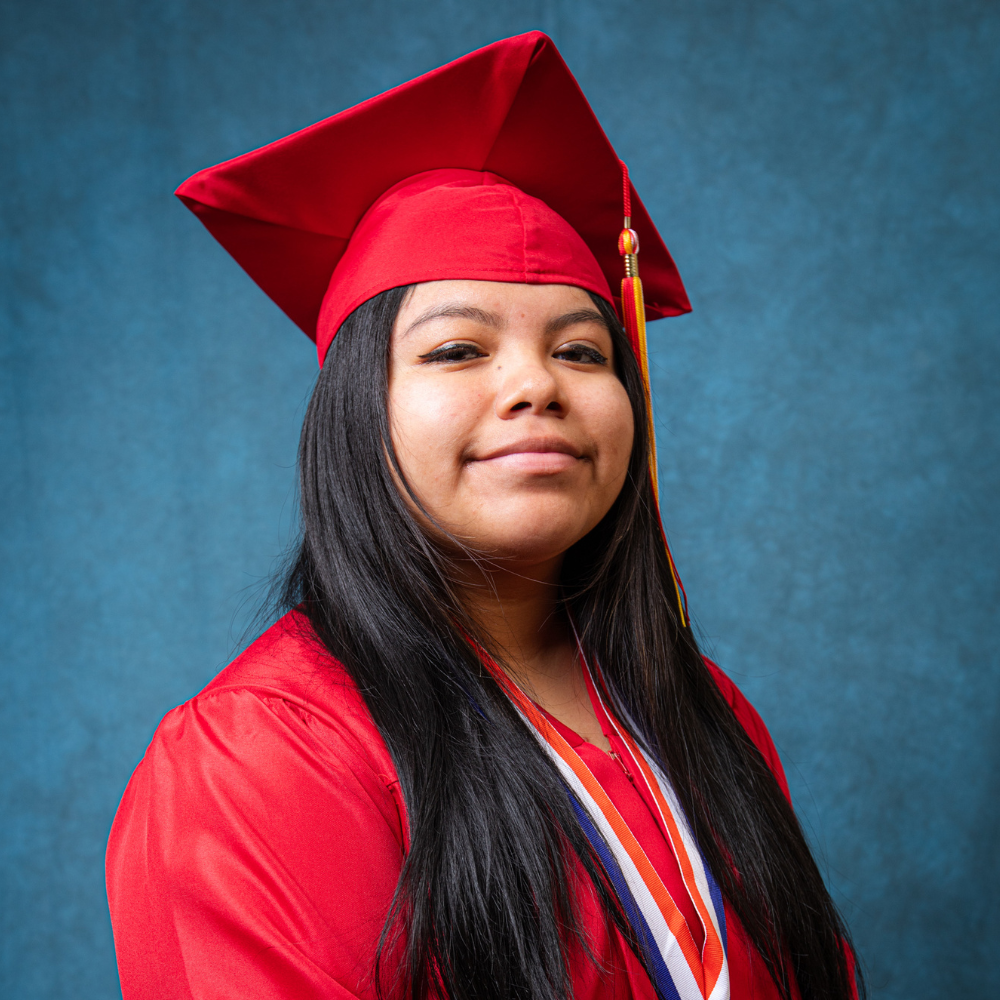 Juliana Diego wearing a red cap and gown.