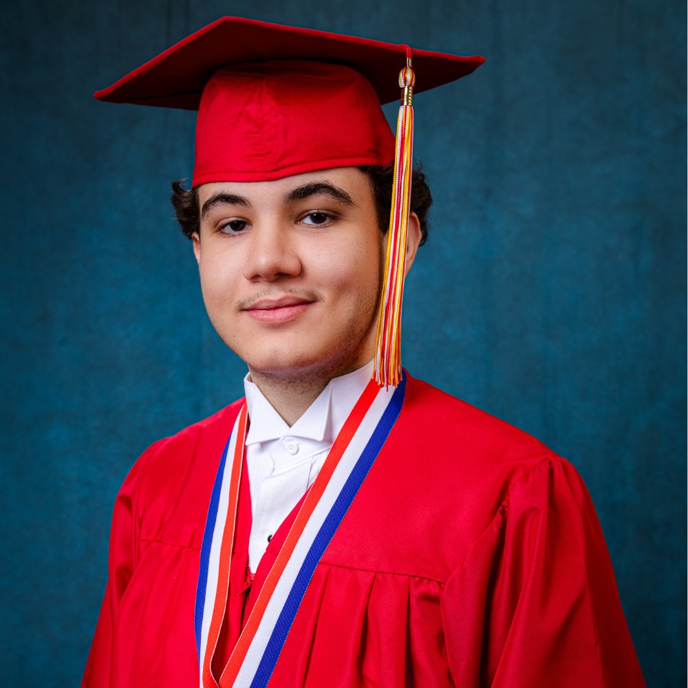 Victor Gonzalez Jr. wearing a red cap and gown.