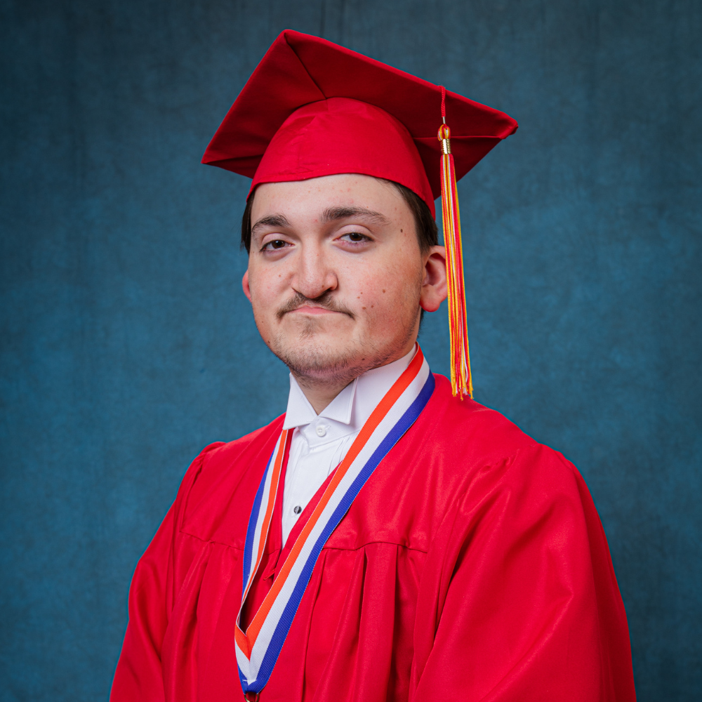 Joseph Wurtz wearing a red cap and gown.