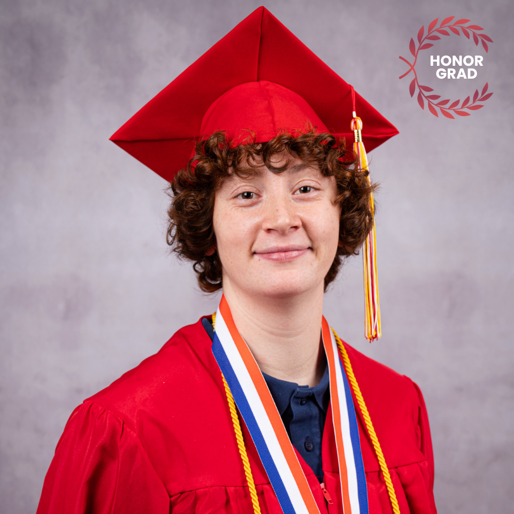 Mariska Dize wearing a red cap and gown.