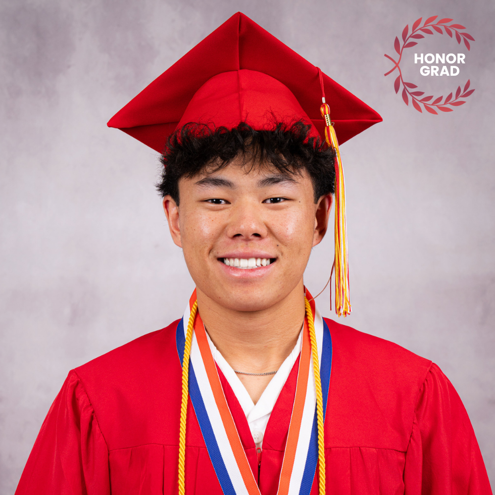 Joshua Hoffnagle wearing a red cap and gown.